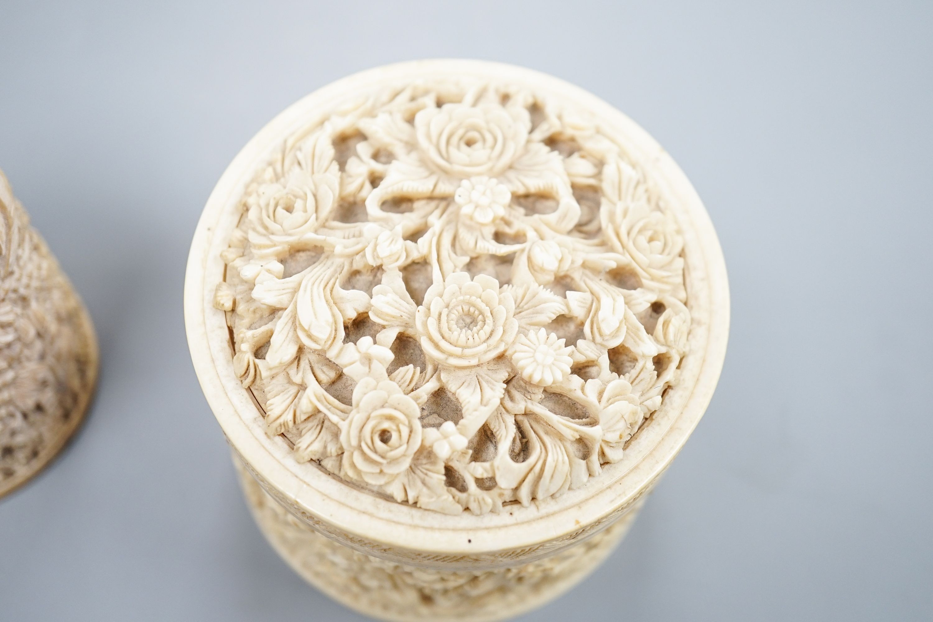 A pair of Chinese carved ivory pots and a Chinese ivory circular box and cover, 19th century